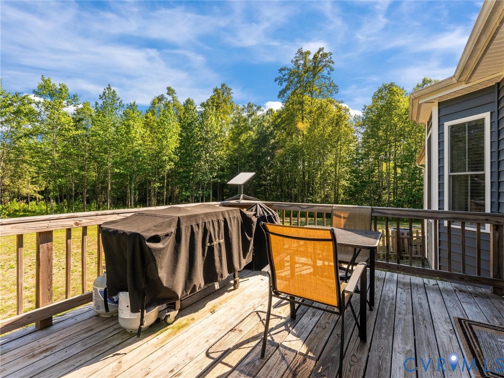 10819 Vaughan Road Petersburg, VA 23805 - Photo 12 of 45 Wood-finish outdoor deck with wood railing, offeri