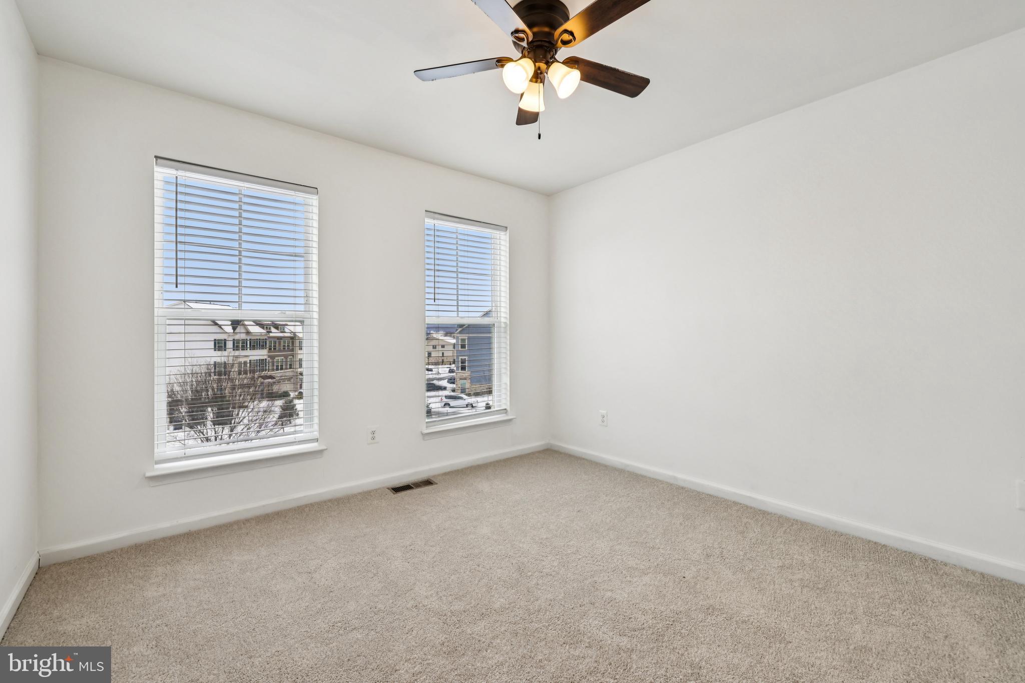 5841 Bella Marie Way Frederick, MD 21703 - Photo 19 of 45 an empty room with windows and fan