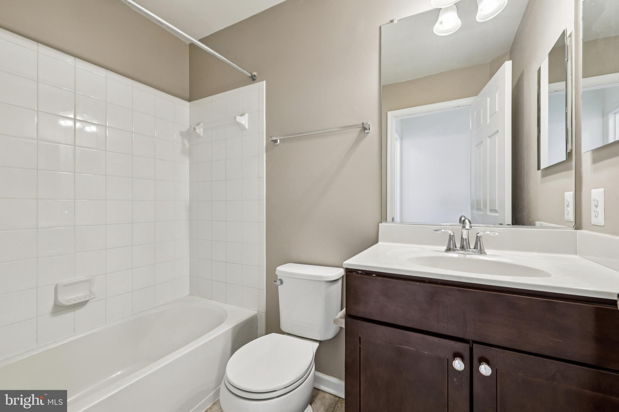 5841 Bella Marie Way Frederick, MD 21703 - Photo 21 of 45 a bathroom with a sink a toilet and shower
