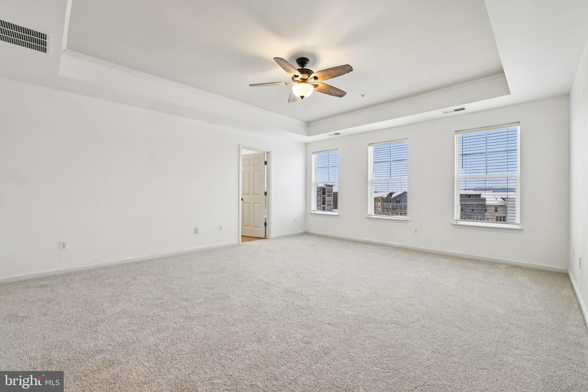 5841 Bella Marie Way Frederick, MD 21703 - Photo 25 of 45 a view of a livingroom with a ceiling fan and window