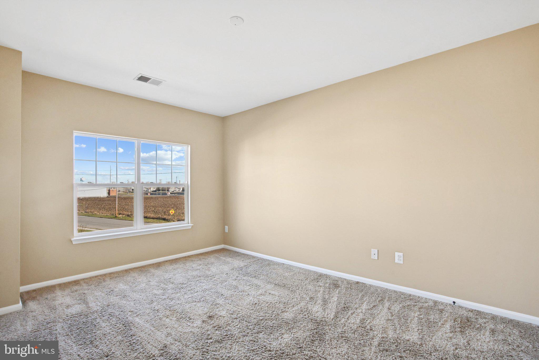 302 Appleby School Road Cambridge, MD 21613 - Photo 16 of 28 a view of an empty room with a window