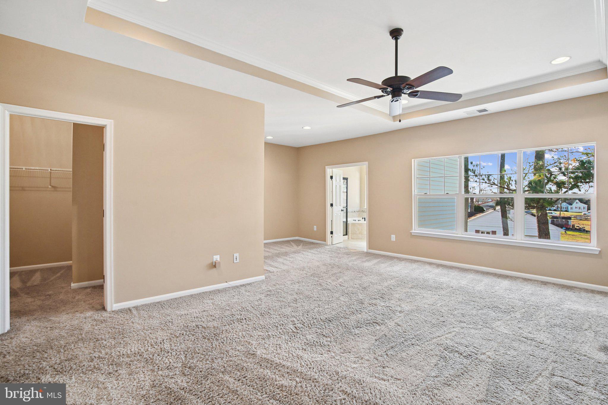 302 Appleby School Road Cambridge, MD 21613 - Photo 21 of 28 a view of a livingroom with a chandelier fan and windows