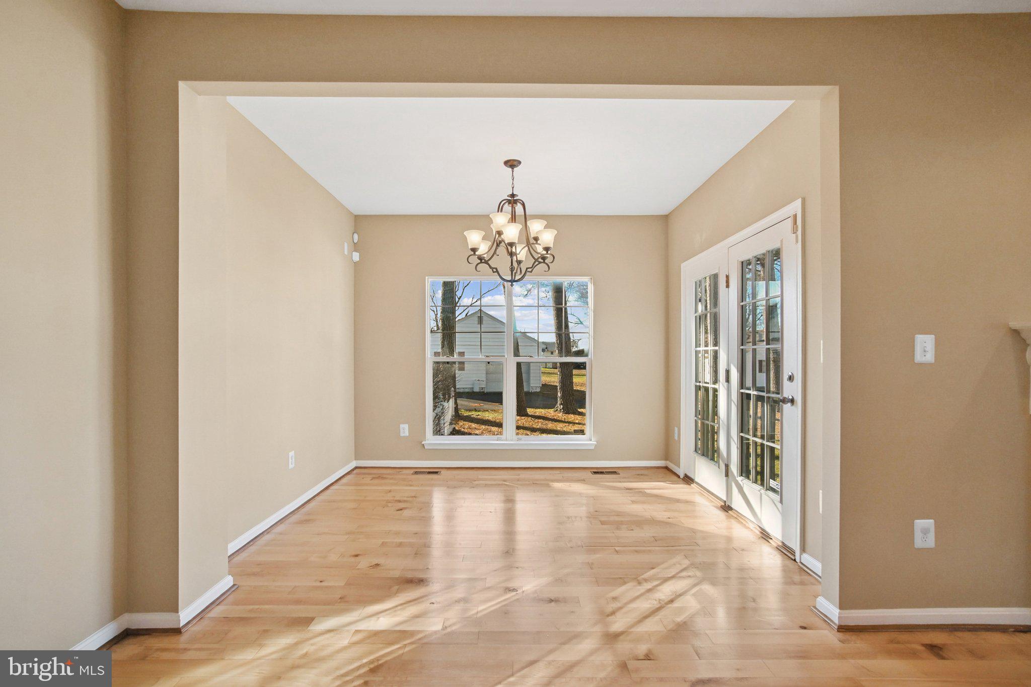 302 Appleby School Road Cambridge, MD 21613 - Photo 6 of 28 a view of a big room with windows and chandelier