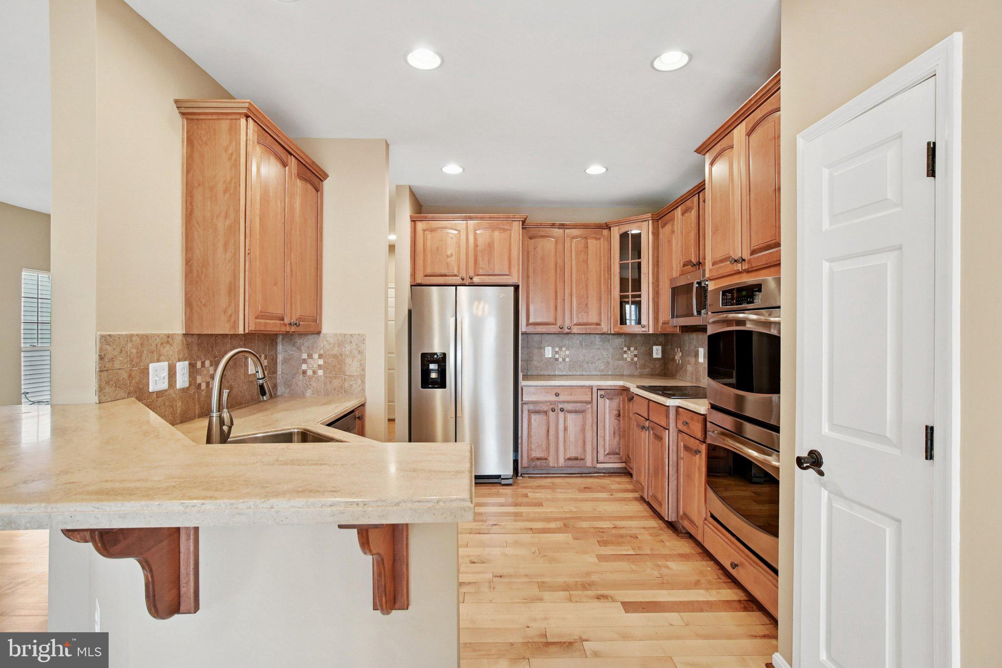 302 Appleby School Road Cambridge, MD 21613 - Photo 8 of 28 a kitchen with stainless steel appliances granite countertop a refrigerator and a sink