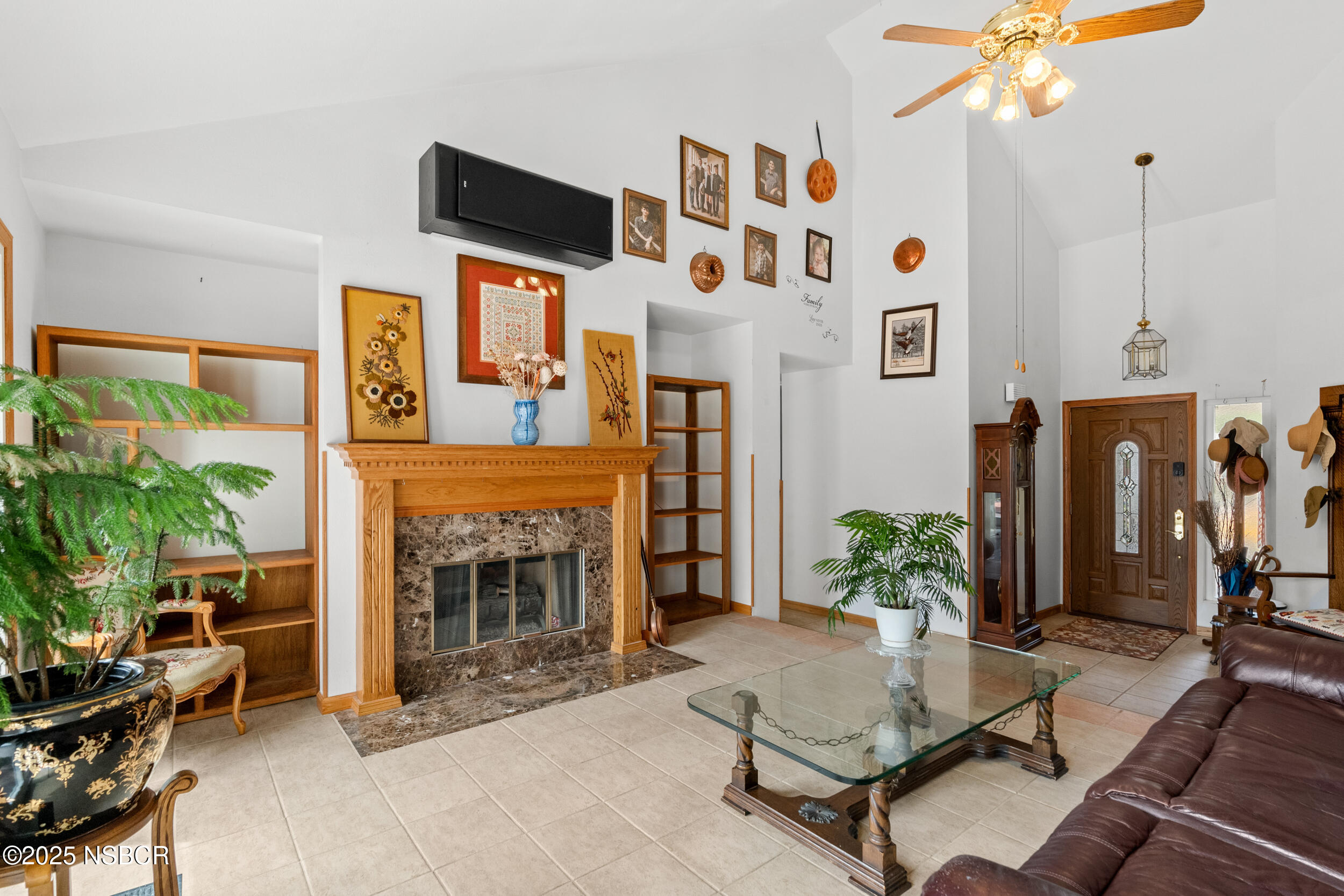 832 Onstott Road Lompoc, CA 93436 - Photo 7 of 50 a living room with furniture a fireplace and a potted plant