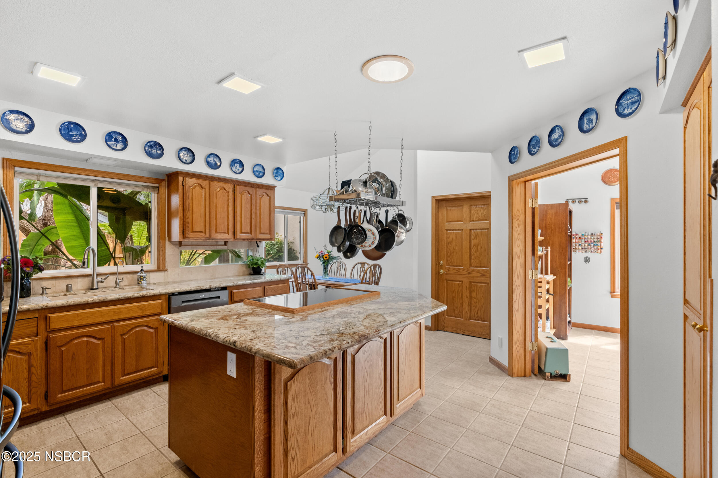832 Onstott Road Lompoc, CA 93436 - Photo 9 of 50 a kitchen with stainless steel appliances granite countertop a sink and a refrigerator