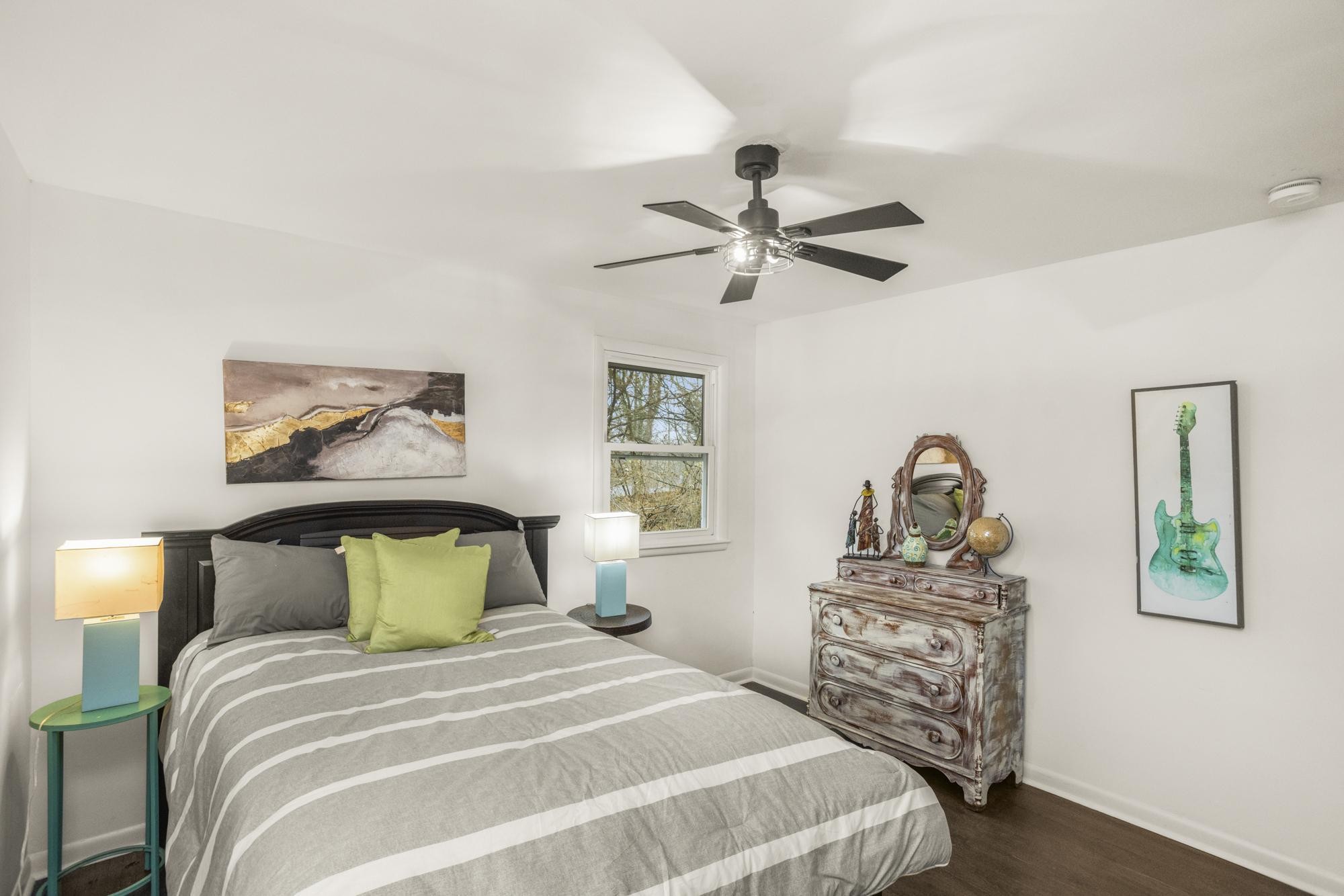 306 Kemper Drive South Madison, TN 37115 - Photo 12 of 42 a bedroom with a bed and a chandelier