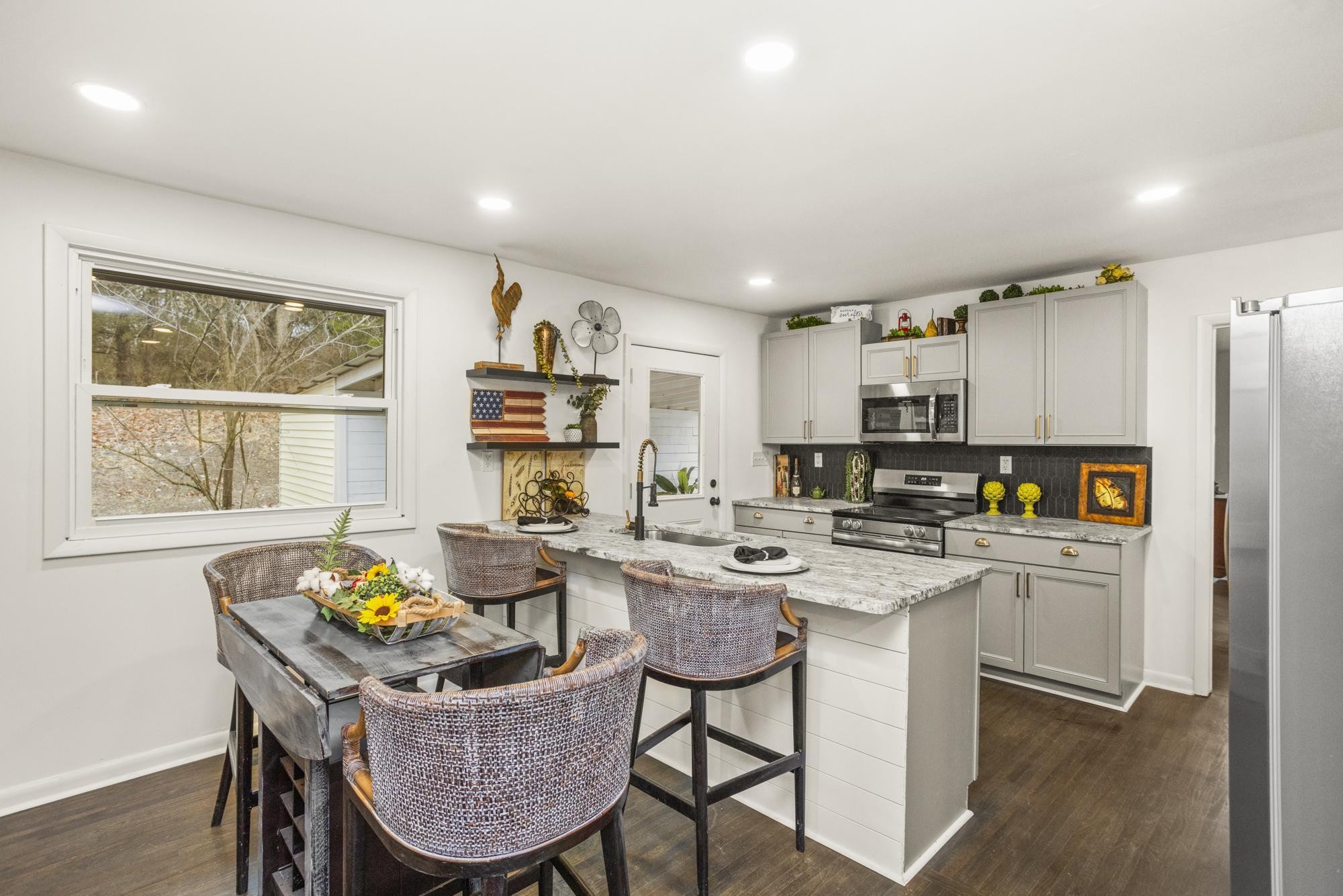 306 Kemper Drive South Madison, TN 37115 - Photo 15 of 42 a kitchen with a dining table chairs and refrigerator