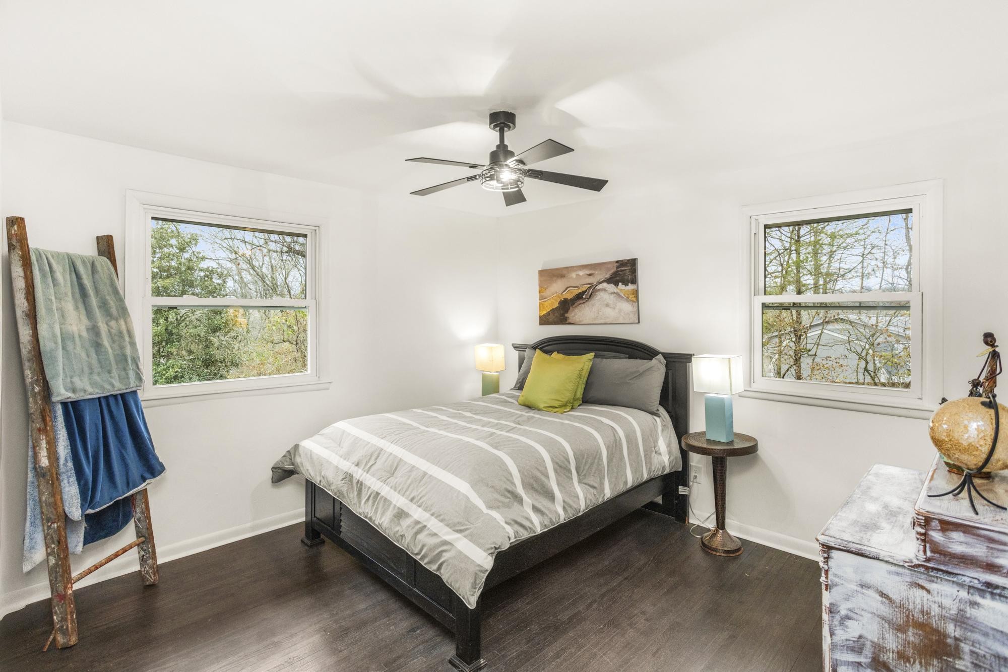 306 Kemper Drive South Madison, TN 37115 - Photo 28 of 42 a bedroom with a bed a chandelier and a window