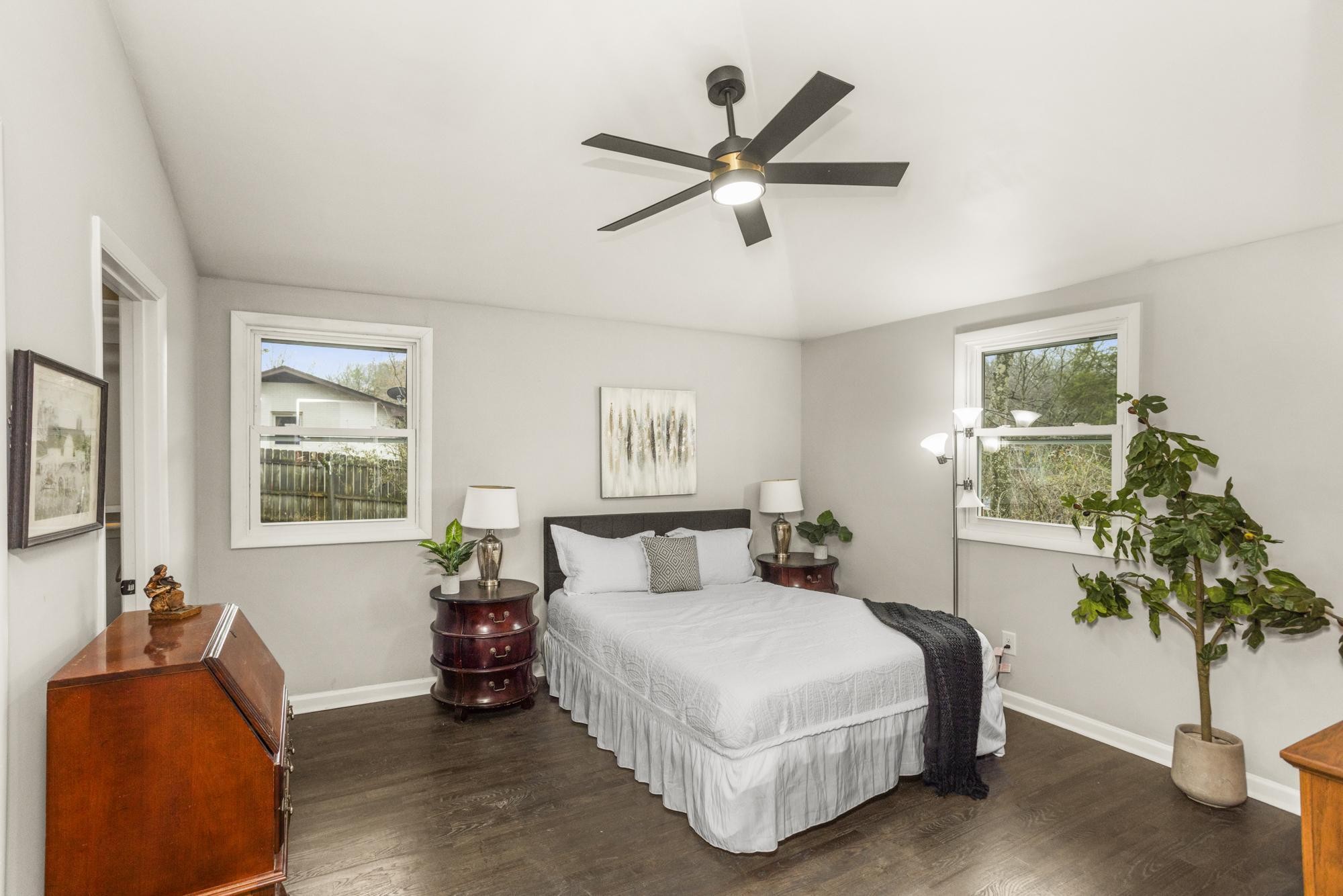 306 Kemper Drive South Madison, TN 37115 - Photo 30 of 42 a bedroom with a bed and a chandelier