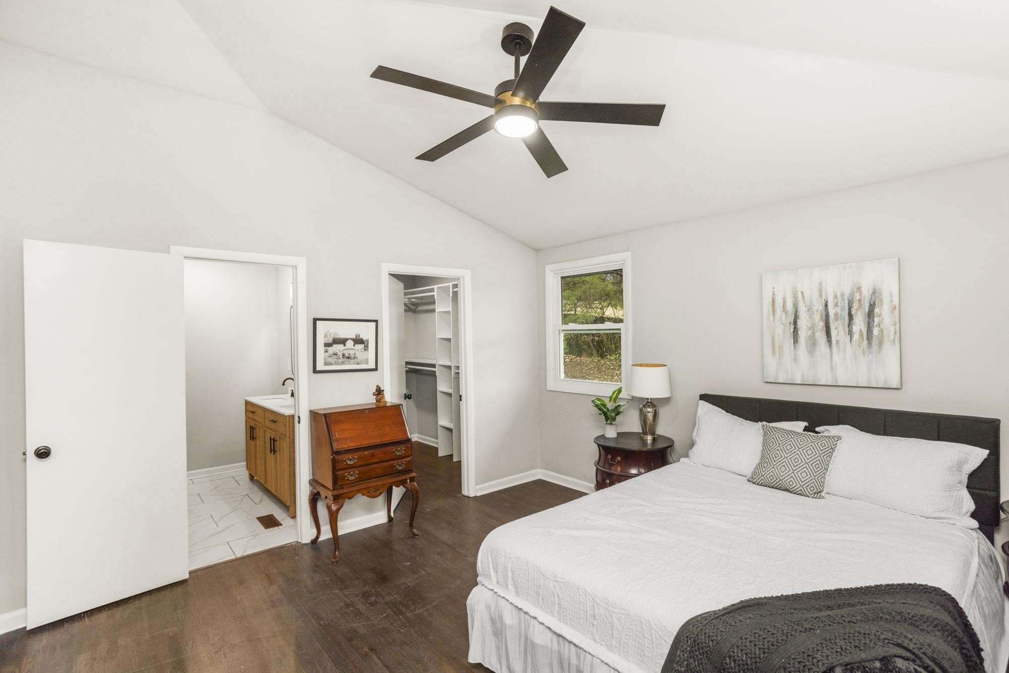 306 Kemper Drive South Madison, TN 37115 - Photo 31 of 42 a bedroom with a bed and a chandelier