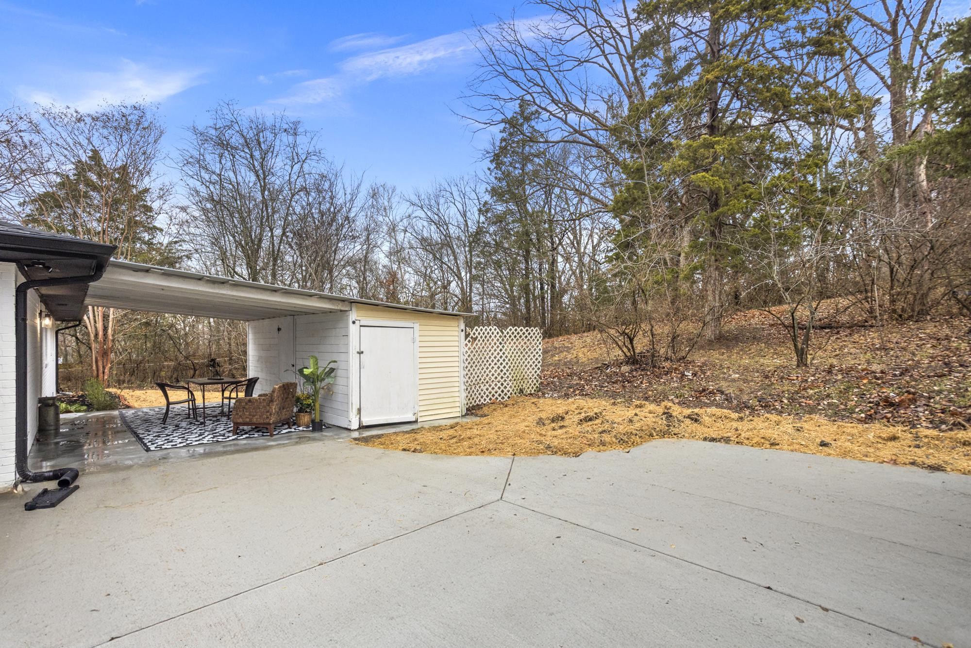 306 Kemper Drive South Madison, TN 37115 - Photo 40 of 42 a view of backyard with wheel chair and potted plants