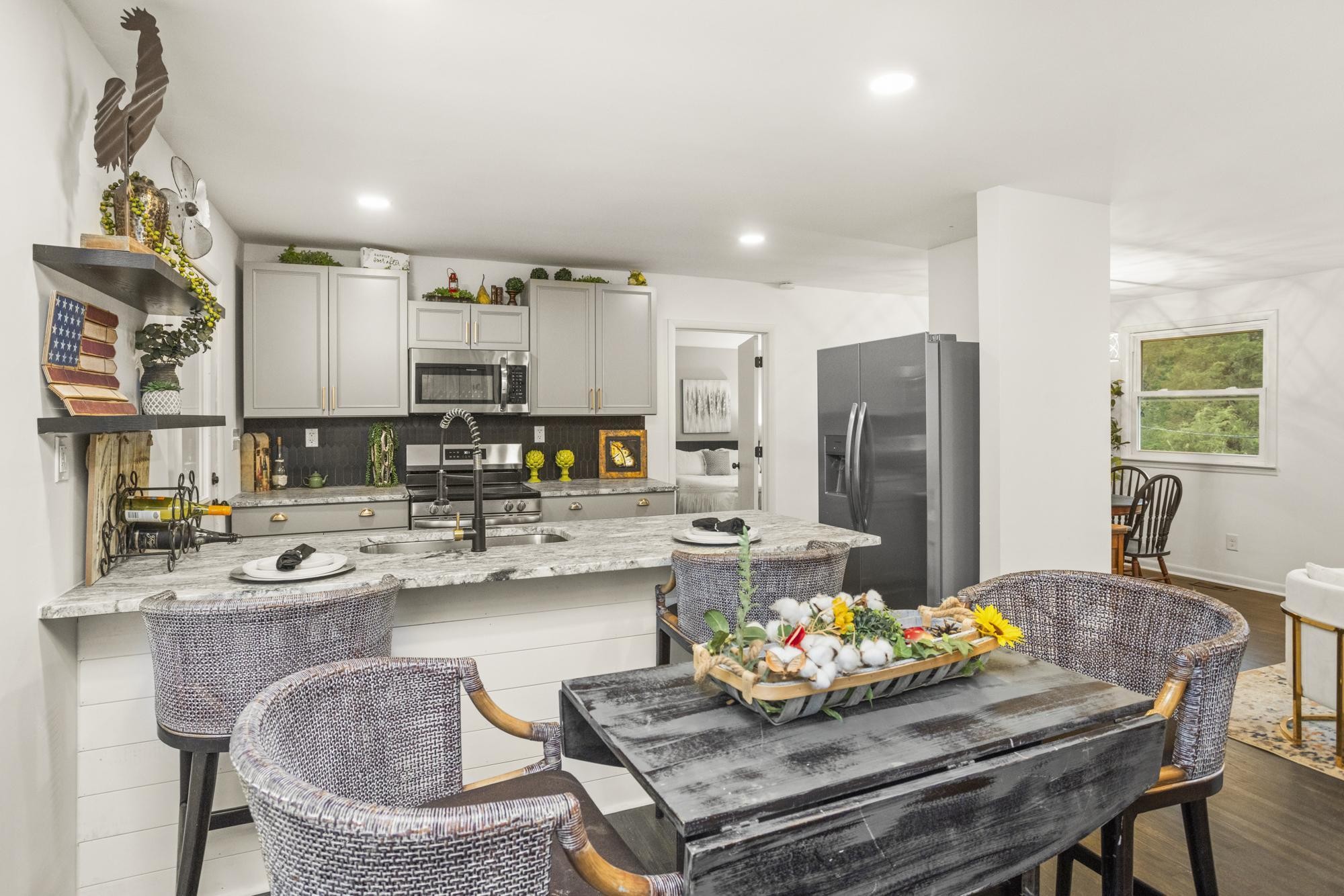 306 Kemper Drive South Madison, TN 37115 - Photo 6 of 42 a kitchen with a dining table and chairs