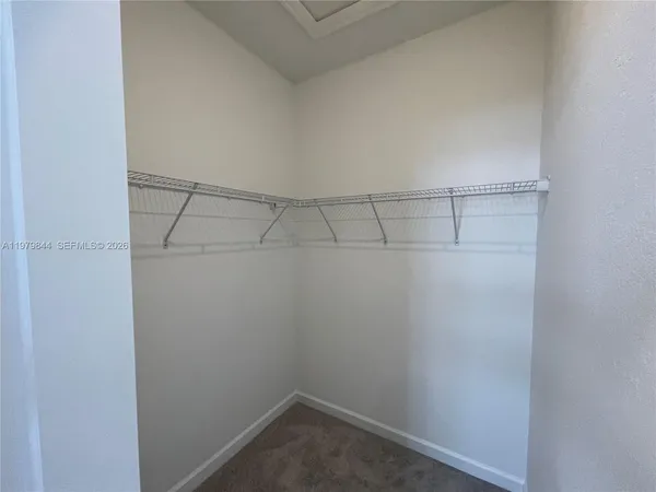 a view of a hallway with a white door