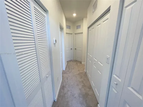 a view of backyard with wooden fence