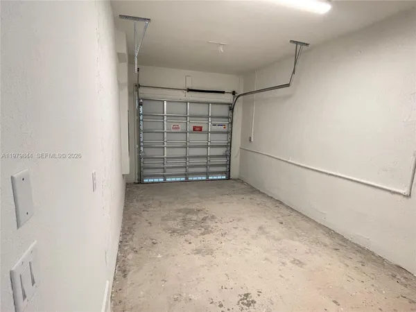 a front view of a house with a garage