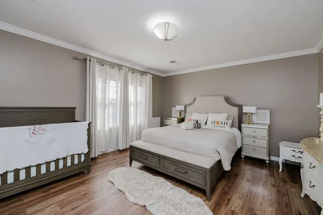 a spacious bedroom with a bed and a window