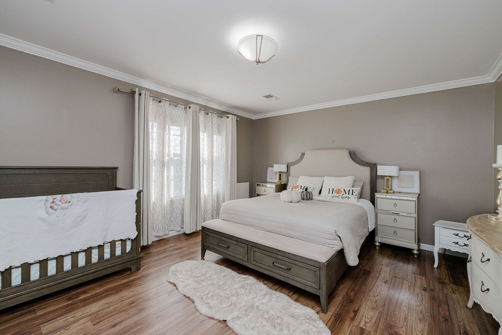 20 Reeves Street Fall River, MA 02721 - Photo 20 of 42 a spacious bedroom with a bed and a window