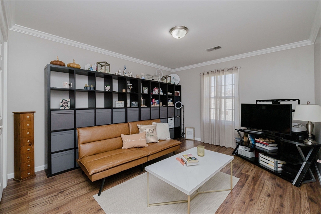 20 Reeves Street Fall River, MA 02721 - Photo 27 of 42 a living room with furniture a rug and a flat screen tv