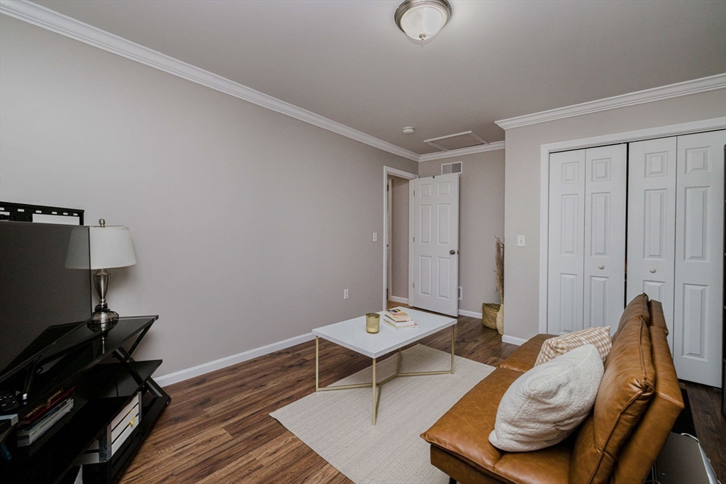 20 Reeves Street Fall River, MA 02721 - Photo 28 of 42 a living room with furniture and a wooden floor
