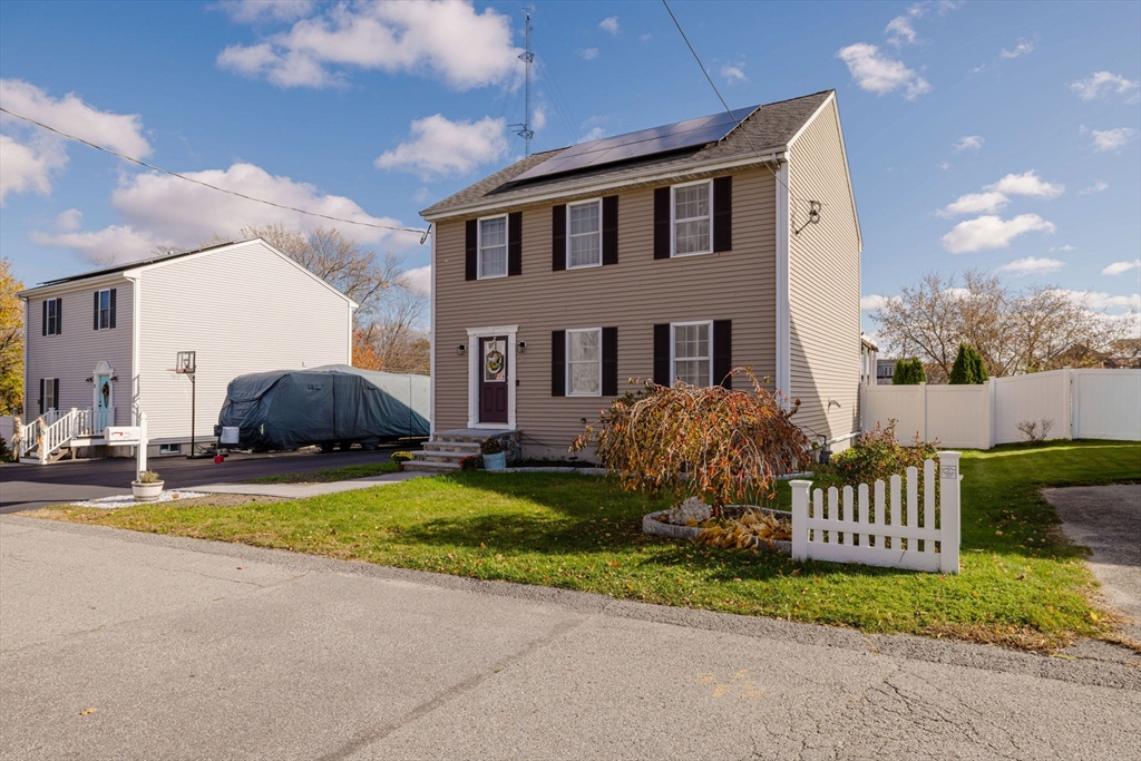 20 Reeves Street Fall River, MA 02721 - Photo 4 of 42 a view of a house with a yard and fence