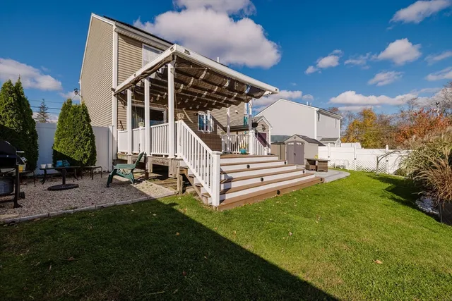 a view of a house with backyard and porch