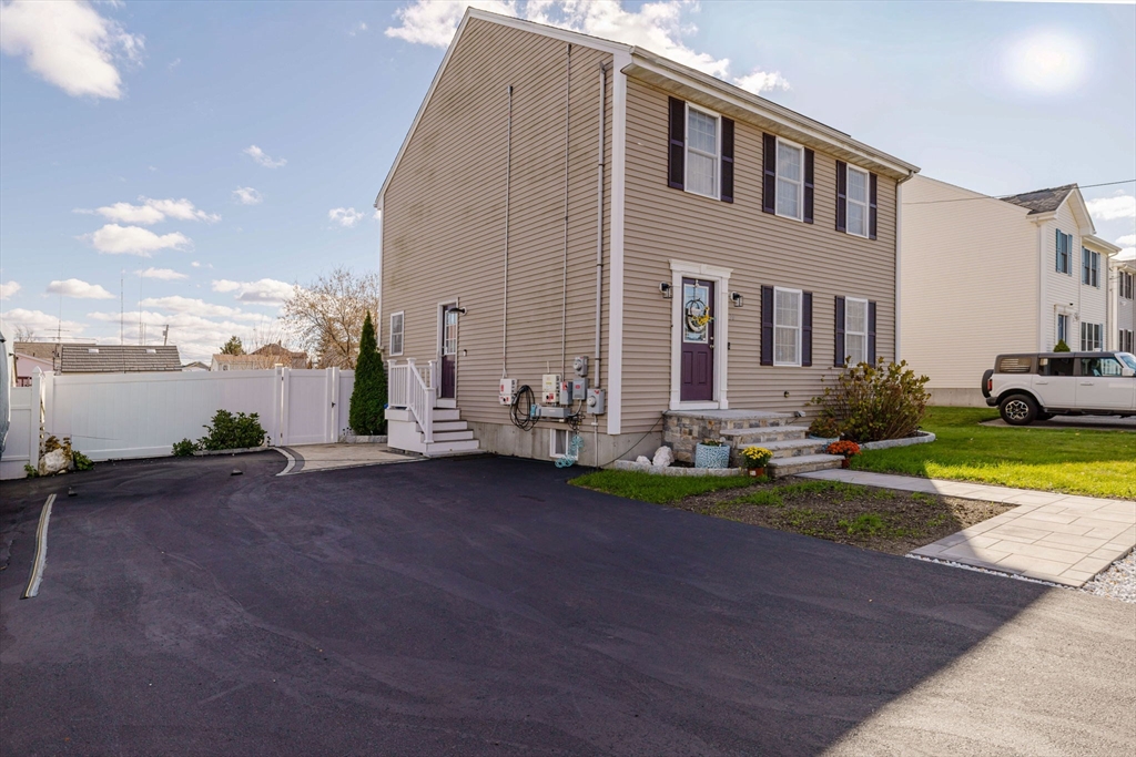 20 Reeves Street Fall River, MA 02721 - Photo 6 of 42 a front view of house with yard and green space