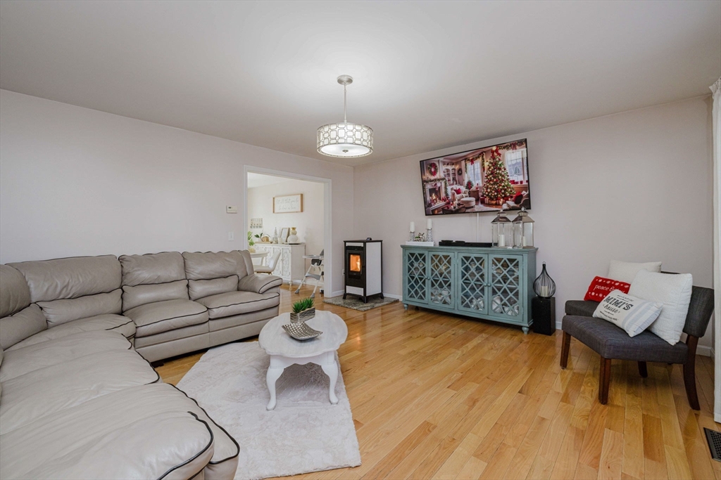 20 Reeves Street Fall River, MA 02721 - Photo 8 of 42 a living room with furniture and a wooden floor
