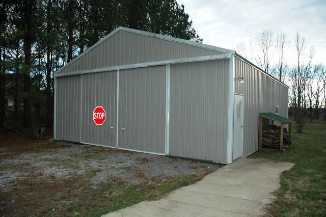 3574 Raymond Head Road Springfield, TN 37172 - Photo 17 of 20 30 x 40 Shop with Electric, Water, Concrete Floors and Nice Woodstove. Storage and Parking.
