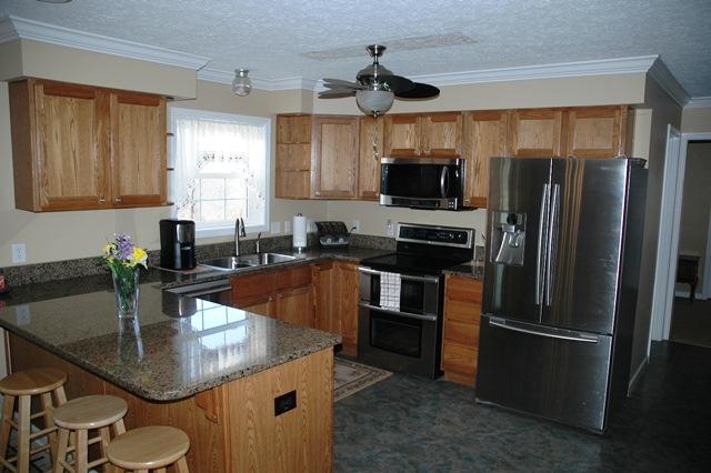 3574 Raymond Head Road Springfield, TN 37172 - Photo 3 of 20 New Granite Counter Tops and New Stainless Steel Appliances. Oak Cabinets Extra Deep Double Sink This is a Top Notch Kitchen