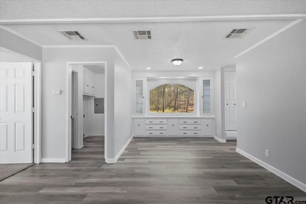 a view of an entryway with wooden floor