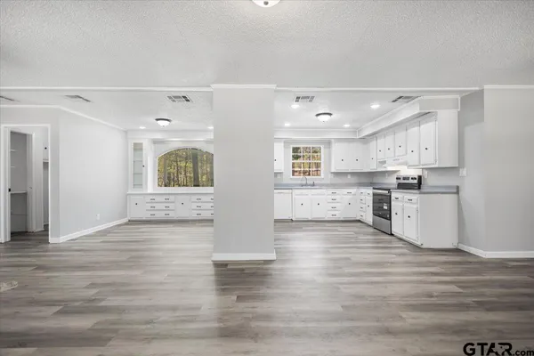 a view of kitchen with wooden floor