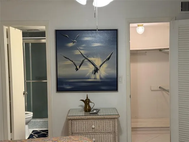 a room with a bench and cabinets