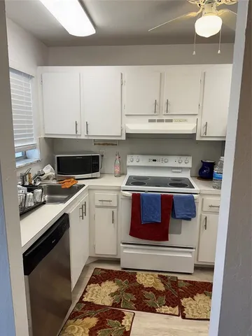 a kitchen with a stove and a sink