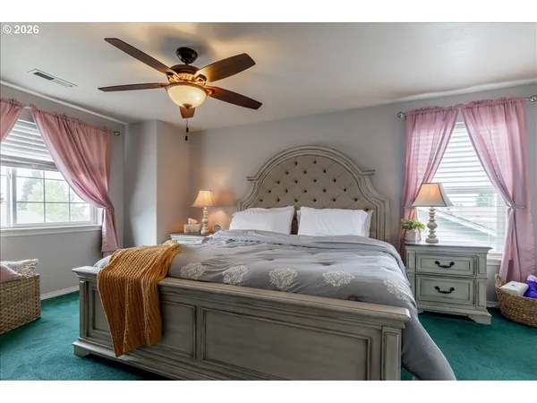 a bedroom with a bed and window