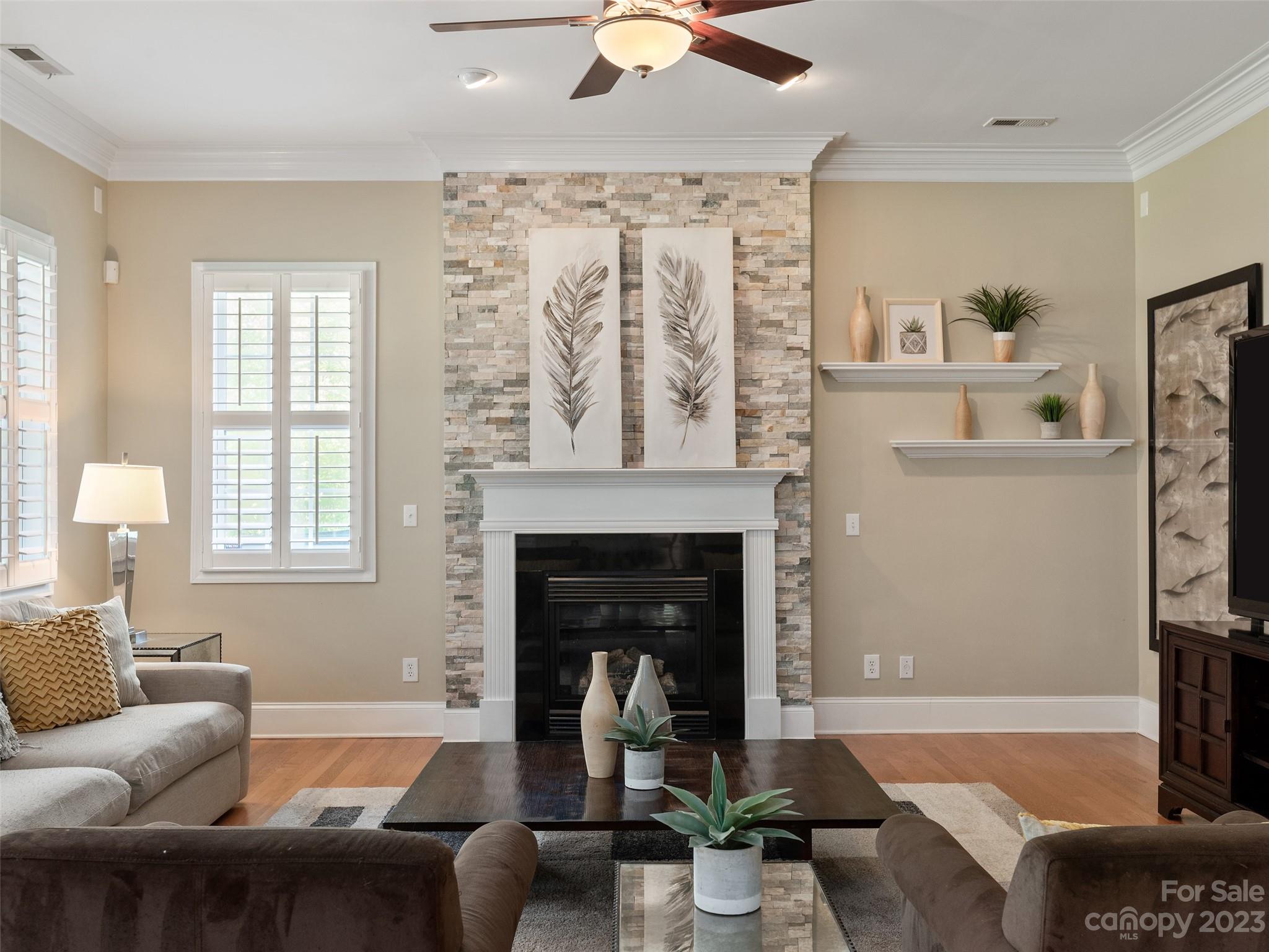 11510 Wheat Ridge Road Charlotte, NC 28277 - Photo 16 of 48 a living room with furniture and a fireplace