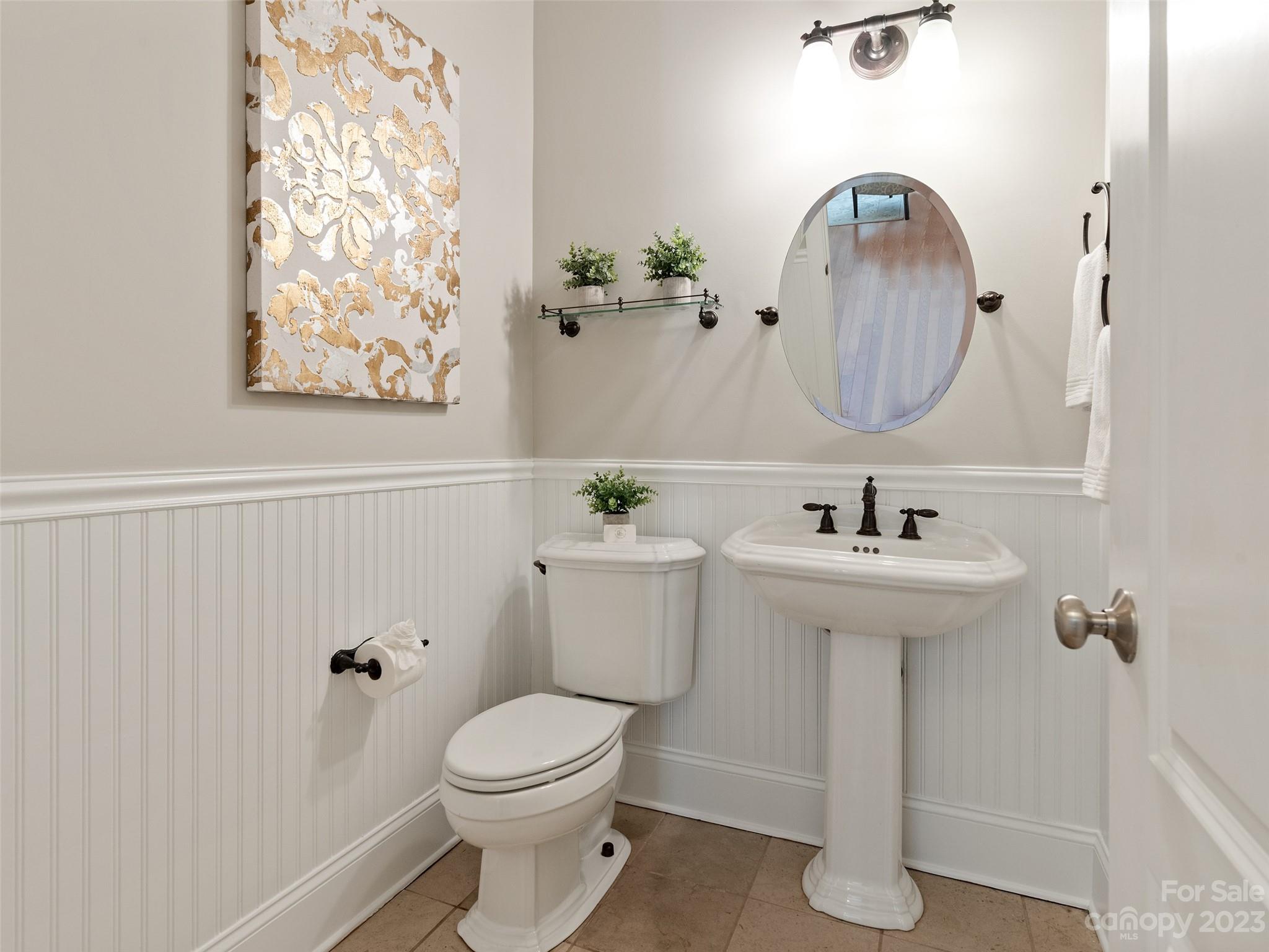 11510 Wheat Ridge Road Charlotte, NC 28277 - Photo 18 of 48 a bathroom with a toilet sink and mirror