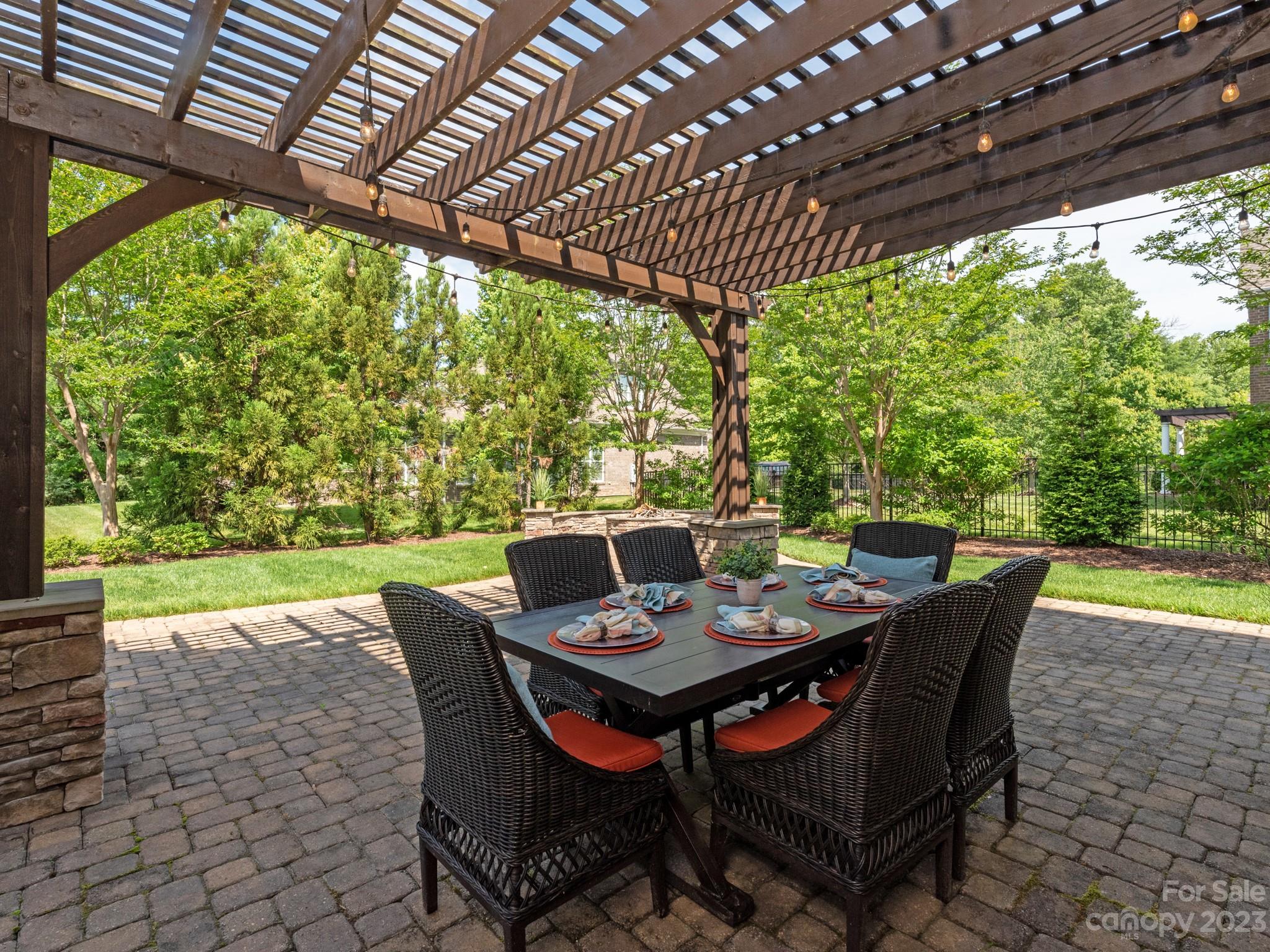 11510 Wheat Ridge Road Charlotte, NC 28277 - Photo 32 of 48 a outdoor dining space with furniture and garden view