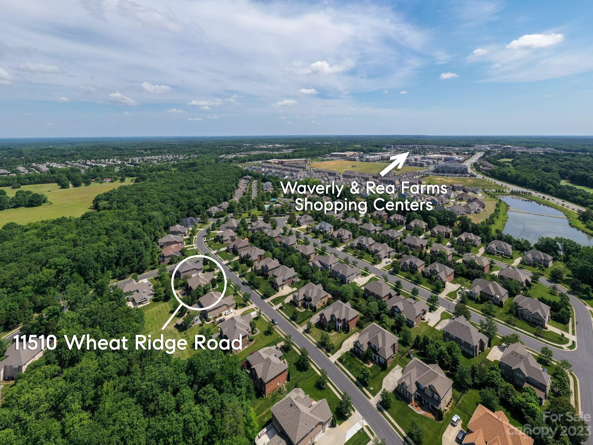 11510 Wheat Ridge Road Charlotte, NC 28277 - Photo 43 of 48 an aerial view of a house with a yard and lake view in back