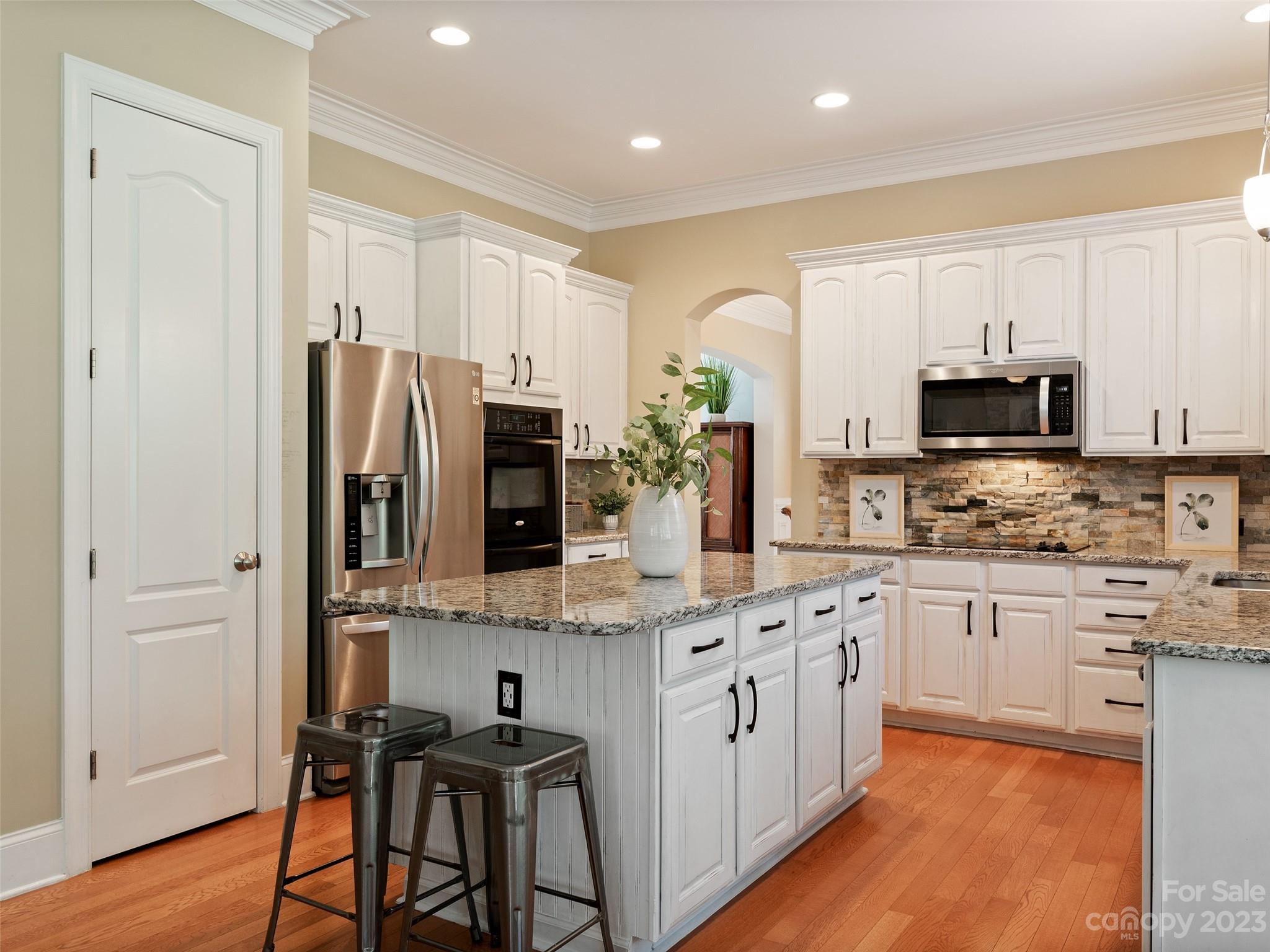 11510 Wheat Ridge Road Charlotte, NC 28277 - Photo 9 of 48 a kitchen with stainless steel appliances granite countertop a refrigerator a stove top oven a sink and dishwasher