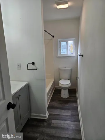 a bathroom with a toilet and a sink