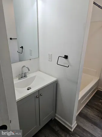 a bathroom with a sink and mirror