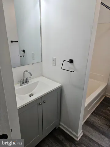 a bathroom with a sink and mirror