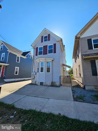 a front view of a house with yard