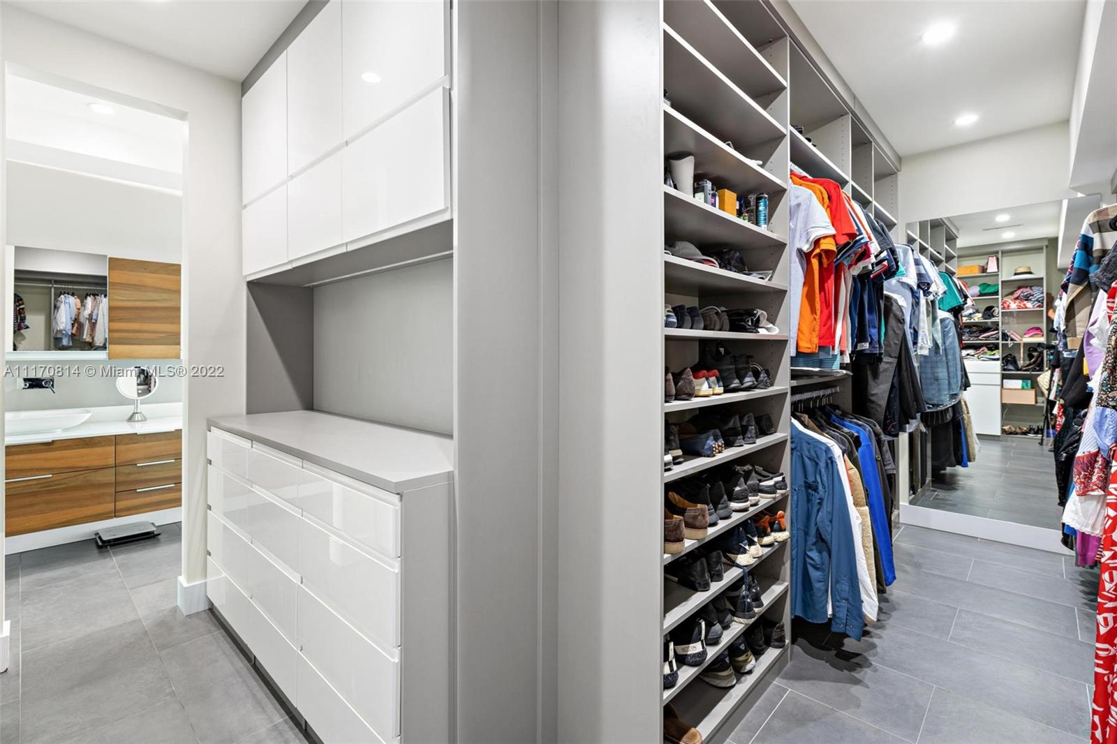 143-xx Stirling Road Southwest Ranches, FL 33330 - Photo 34 of 76 a view of walk in closet with clothes and shoes