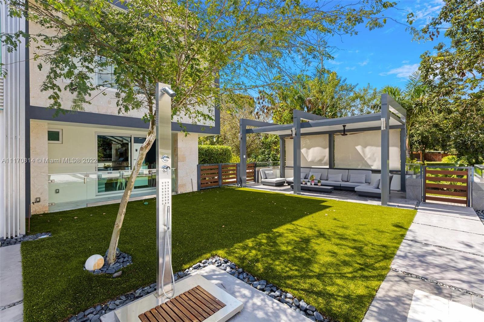 143-xx Stirling Road Southwest Ranches, FL 33330 - Photo 58 of 76 a view of a house with swimming pool and sitting area