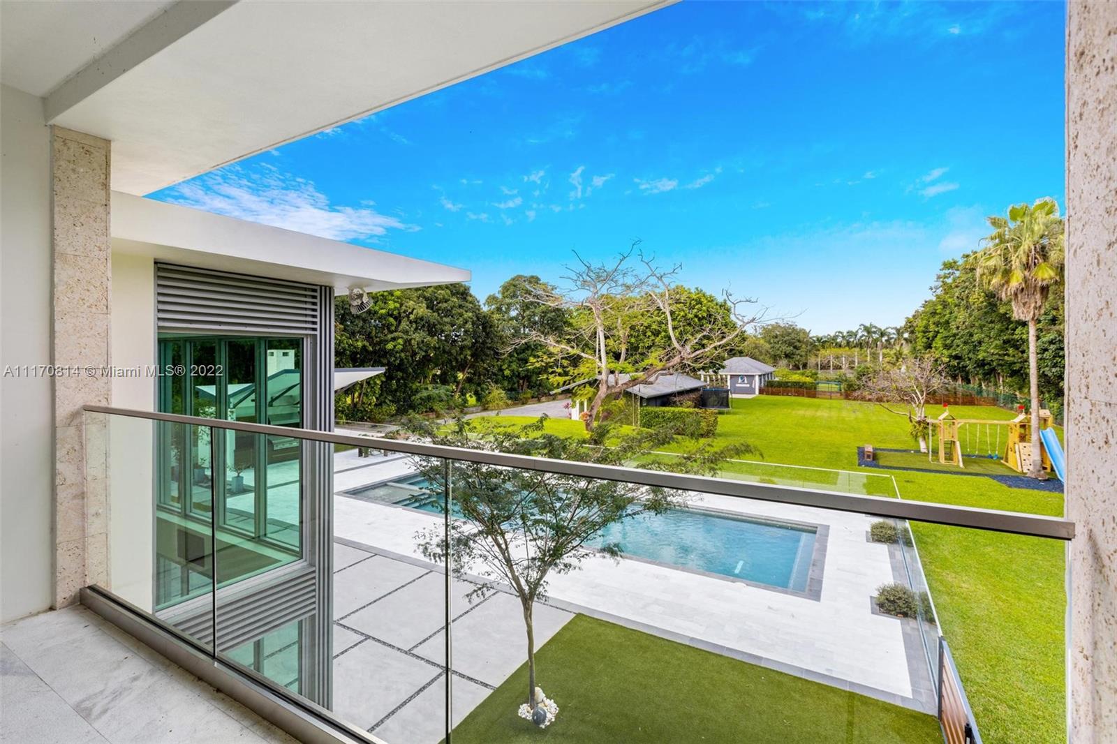 143-xx Stirling Road Southwest Ranches, FL 33330 - Photo 64 of 76 a view of a swimming pool with a patio