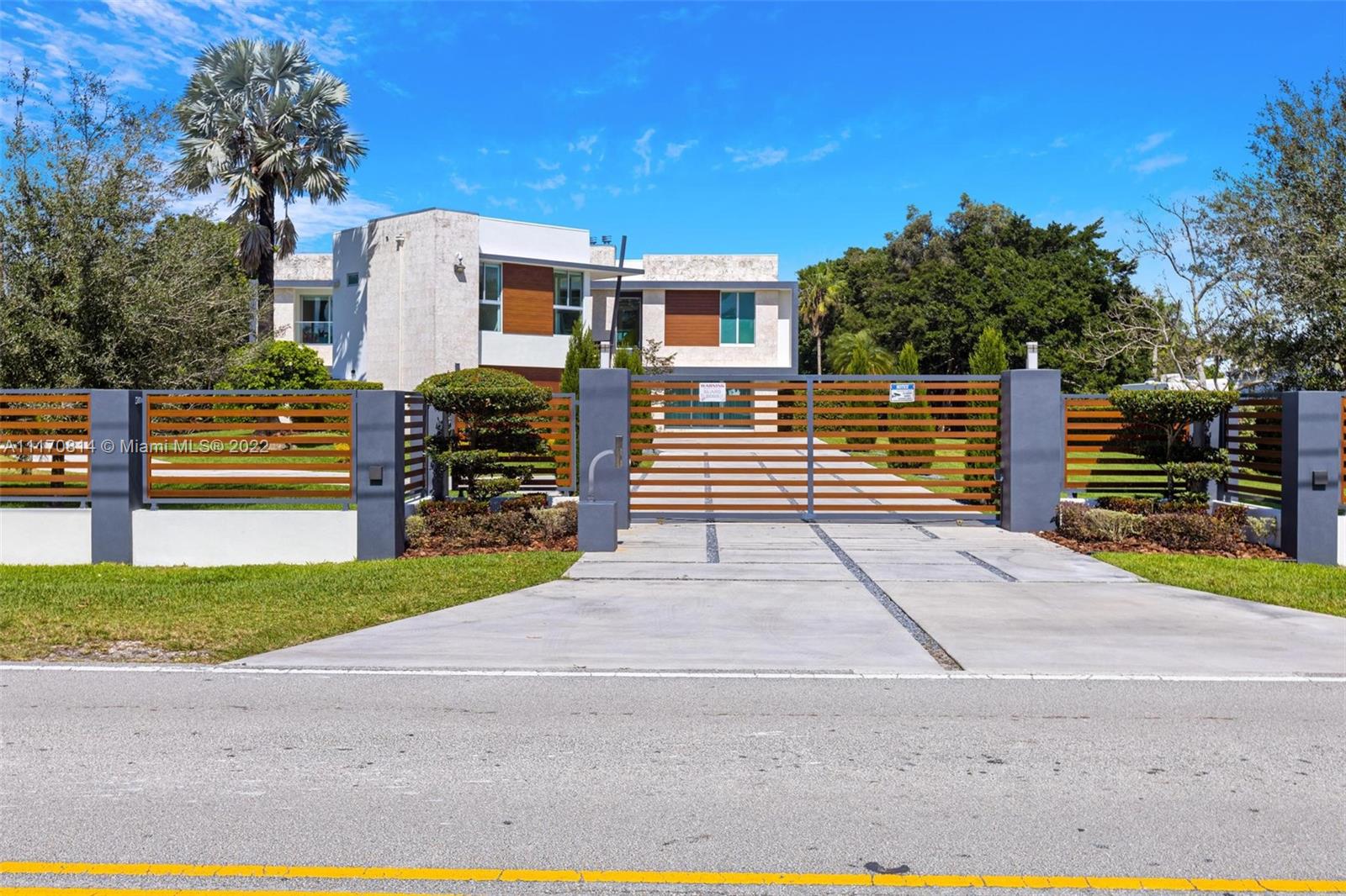 143-xx Stirling Road Southwest Ranches, FL 33330 - Photo 76 of 76 a front view of a house with a yard