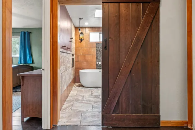 a view of a bathroom from a corridor