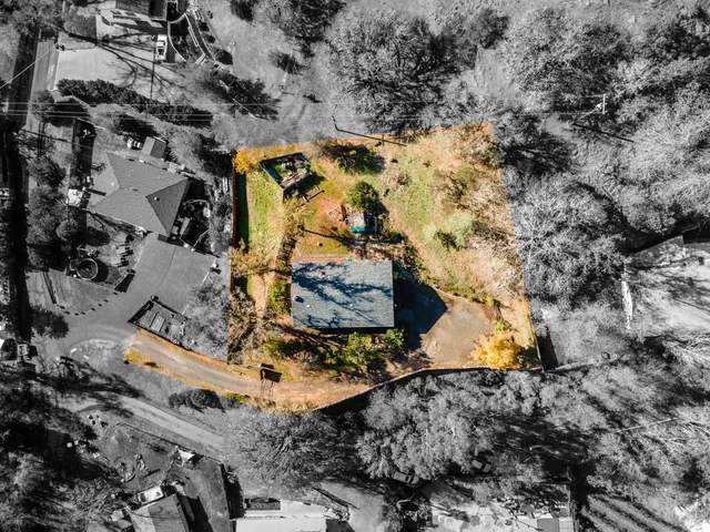 an aerial view of residential house with outdoor space